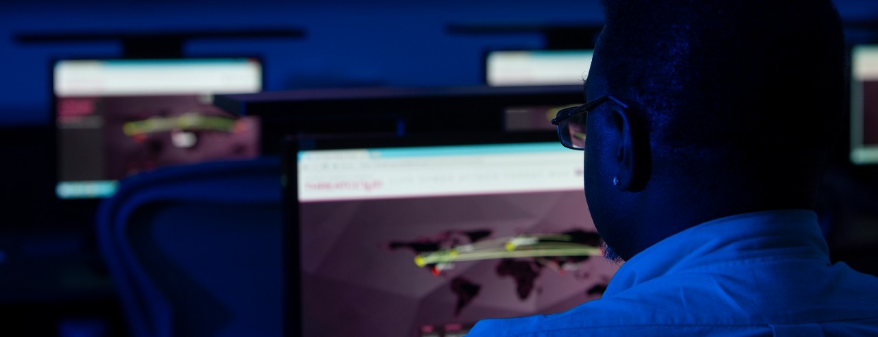 Cyber security computer lab with dark, moody lighting