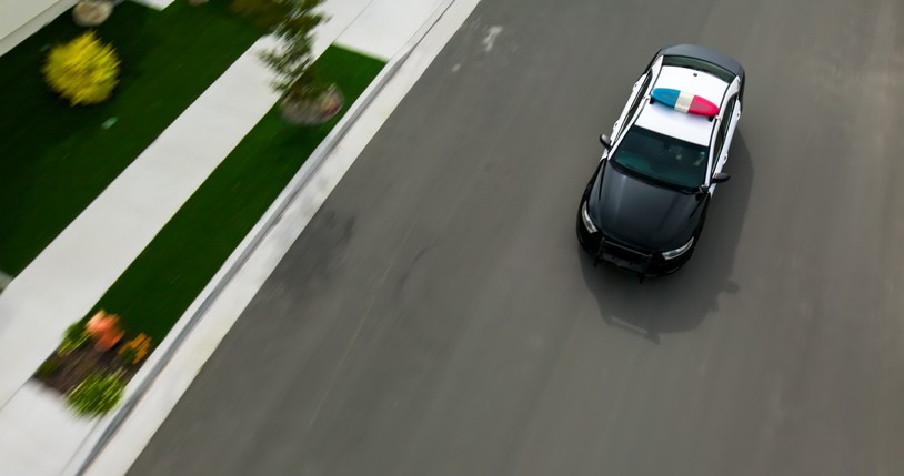 Police car on suburban road