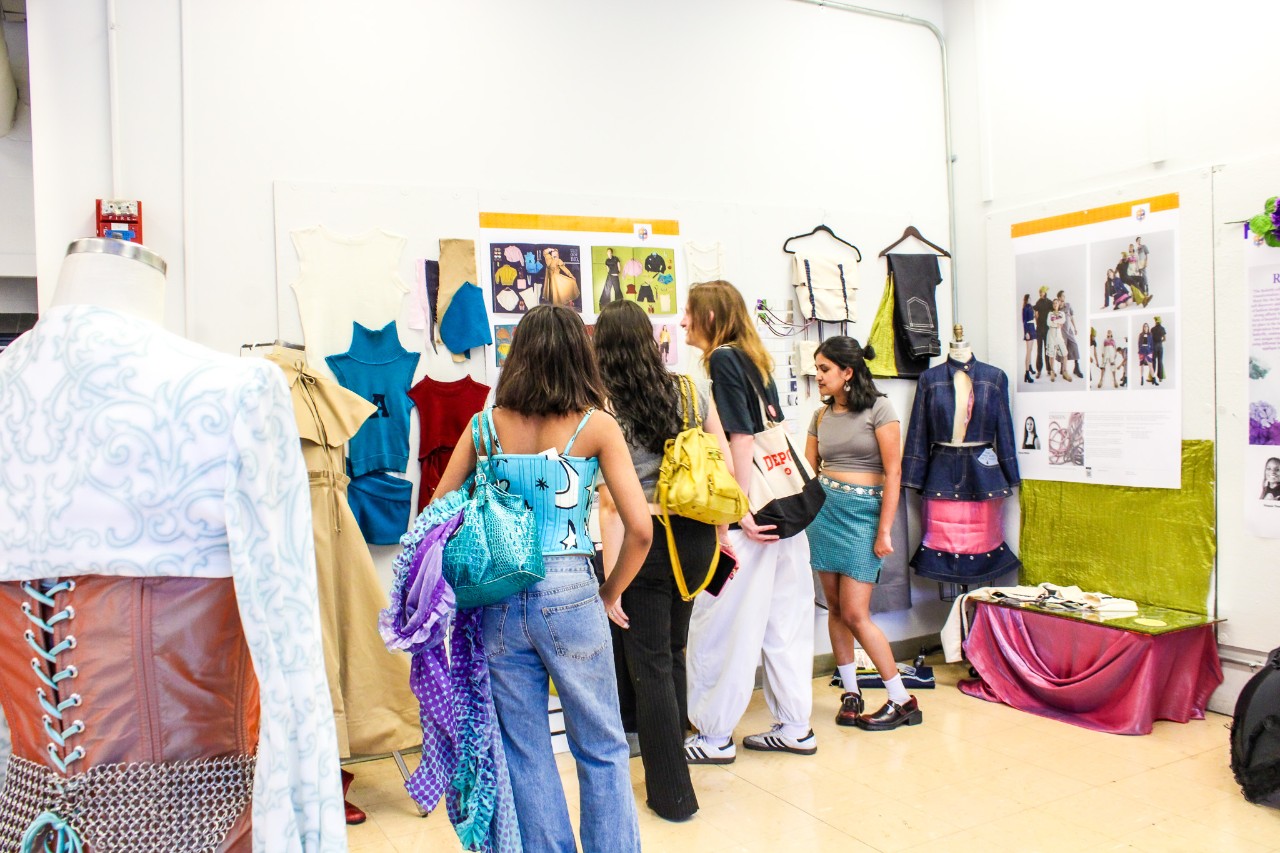 attendees at DAAPworks 2025 looking at displays