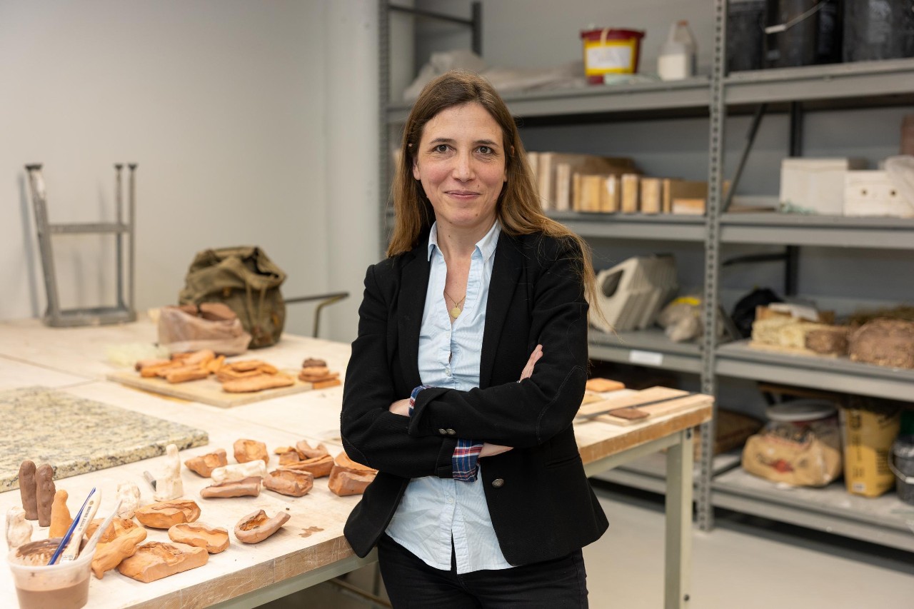 Portrait of UC Professor Florence Gaignerot-Driessen in a UC ceramics lab.