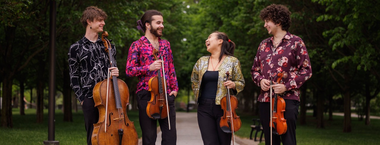 Members of the Poiesis Quartet pose with their instruments 