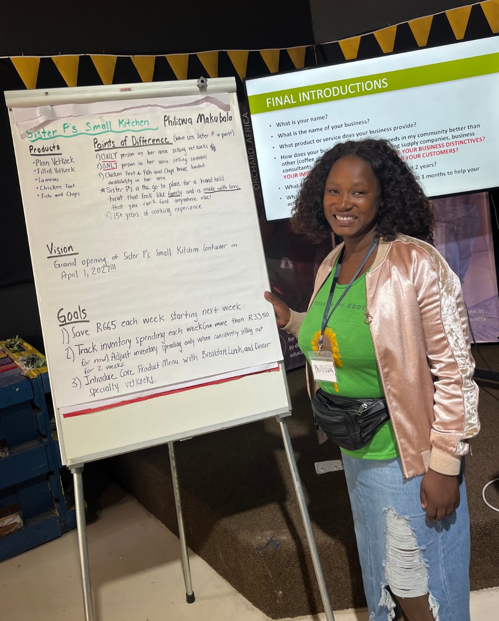 Philiswa Makubalo delivers a presentation in front of an easel