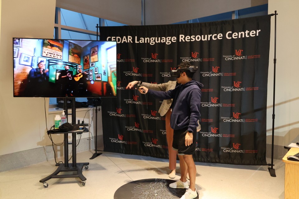 People demonstrate the VR capabilities available through UC's CEDAR language center. 