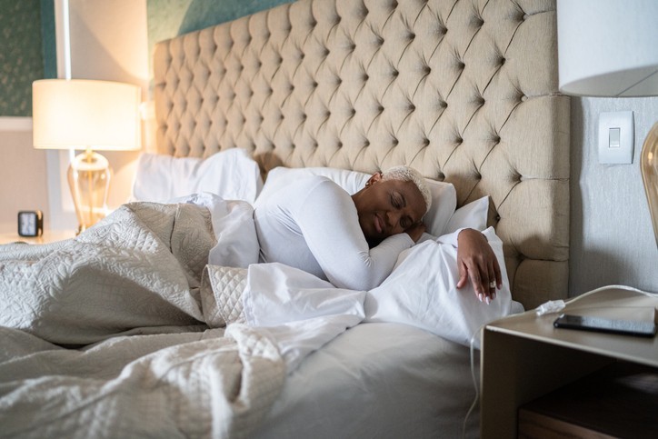 A woman asleep in a bed