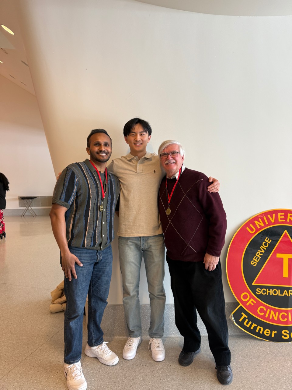 Perry Li with a teaching assistant and a professor