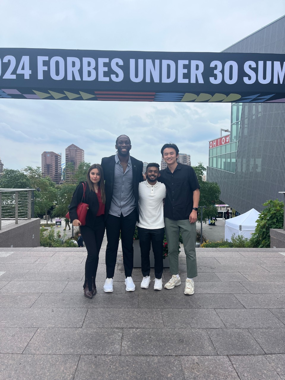 Perry Li and Lindner College of Business students at a summit.