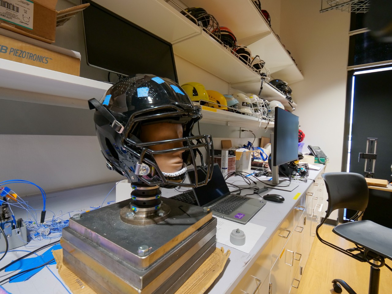 A closeup of a sensor dummy in a helmet.