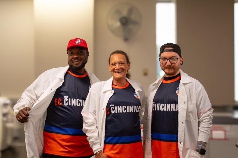 Hoxworth lab workers with FC Cincinnati jerseys