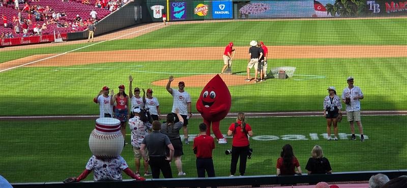 Hoxworth leadership on the field with the first pitch winner