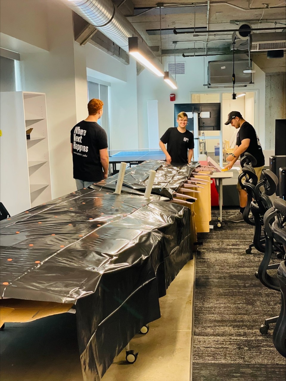 The students work on assembling the wings.