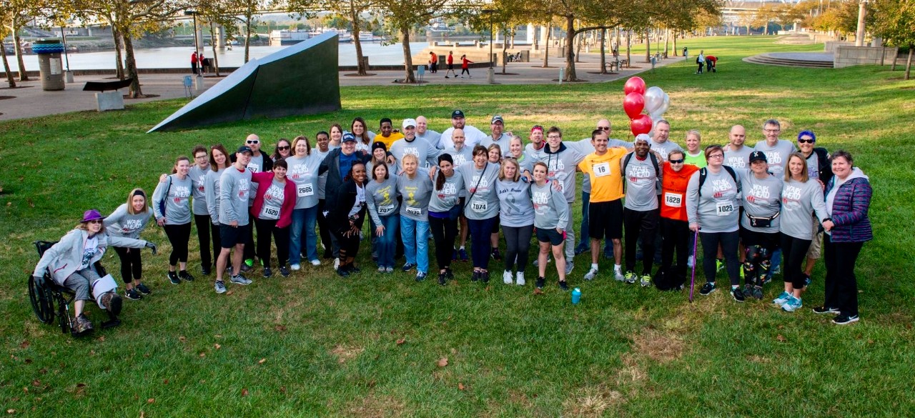 Several survivors of brain tumors stand together along Sawyer Point during the annual 'Walk Ahead for Brain Tumor Discoveries' fund raiser event.