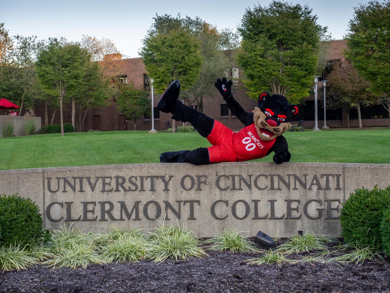 Bearcat poses on UC Clermont sign