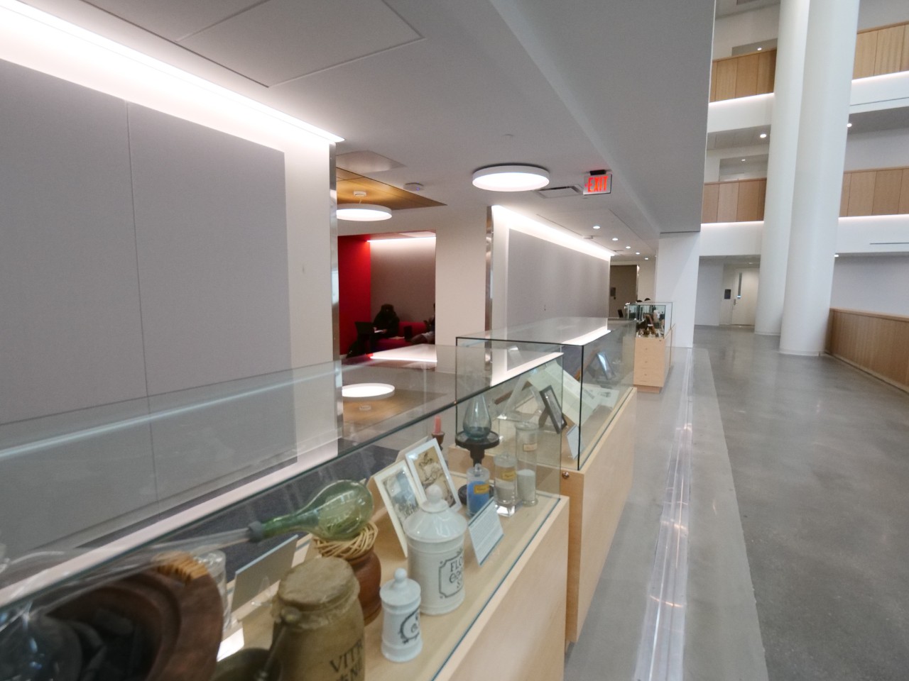 Glass cabinets feature antique chemistry equipment, photos and documents. 