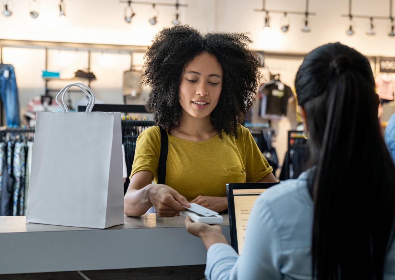Small business transaction taking place. Photo/Adobe Stock