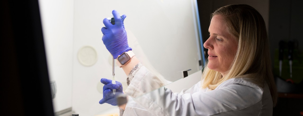  Joan Garrett PhD, working in her lab and an environmental portrait.