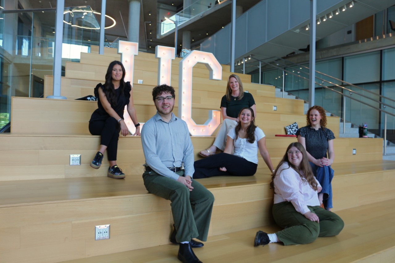 Andrea Ford with students in Health Sciences Building atrium 