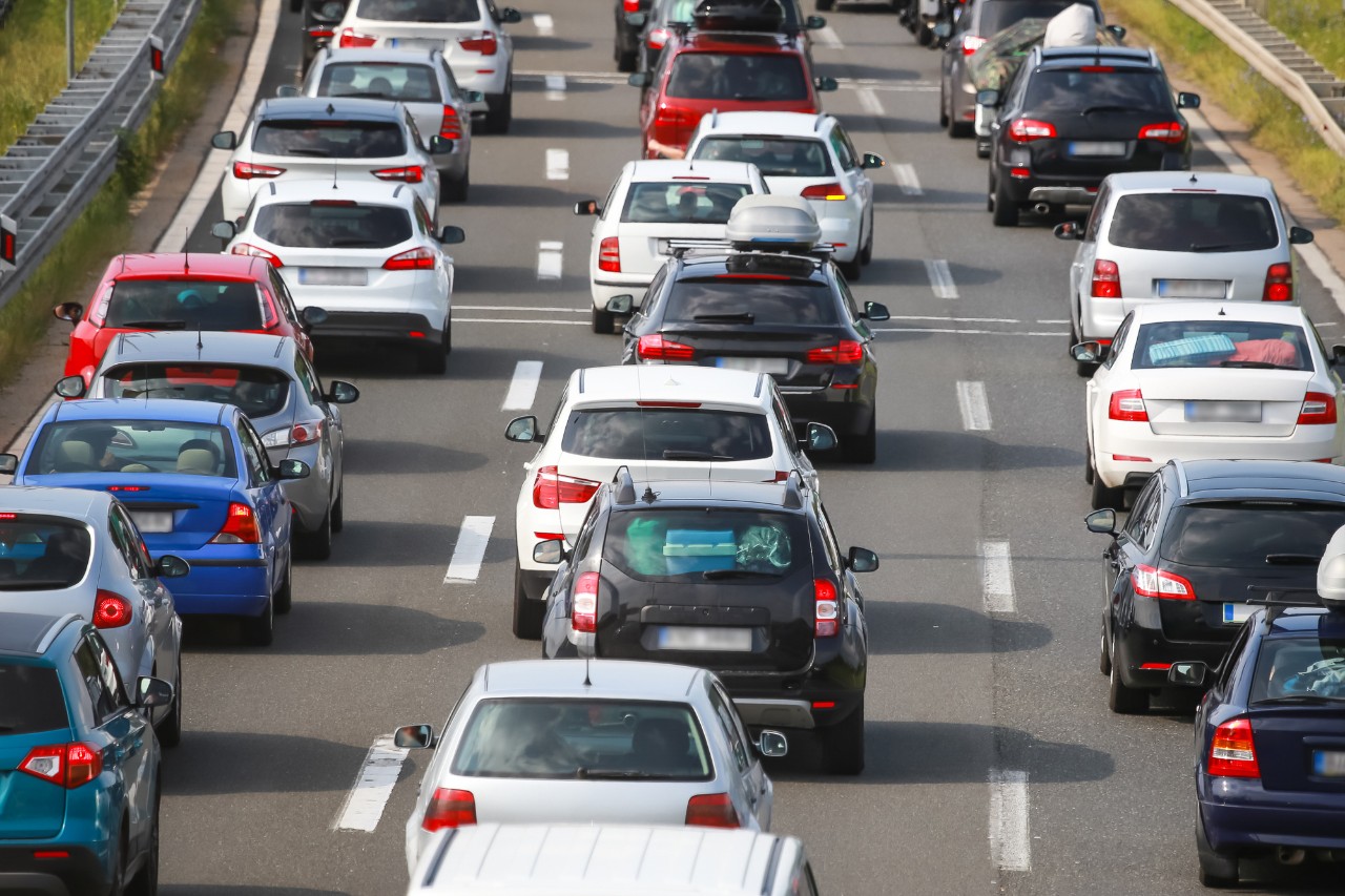 Bumper-to-bumper traffic on a three-lane highway.