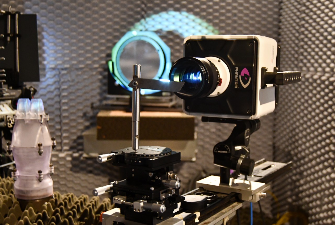 A high-speed camera sits in front of a mirror in an anechoic chamber.