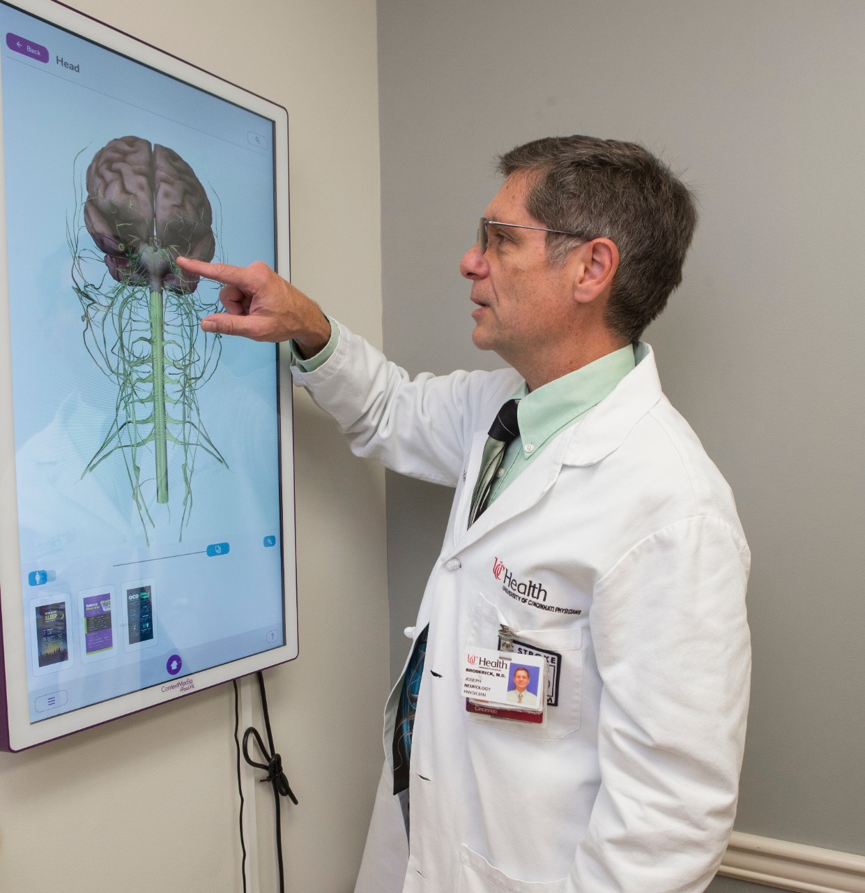 Dr. Joseph Broderick shown here looking as Brain Scans at MAB. UC/ Joseph Fuqua II