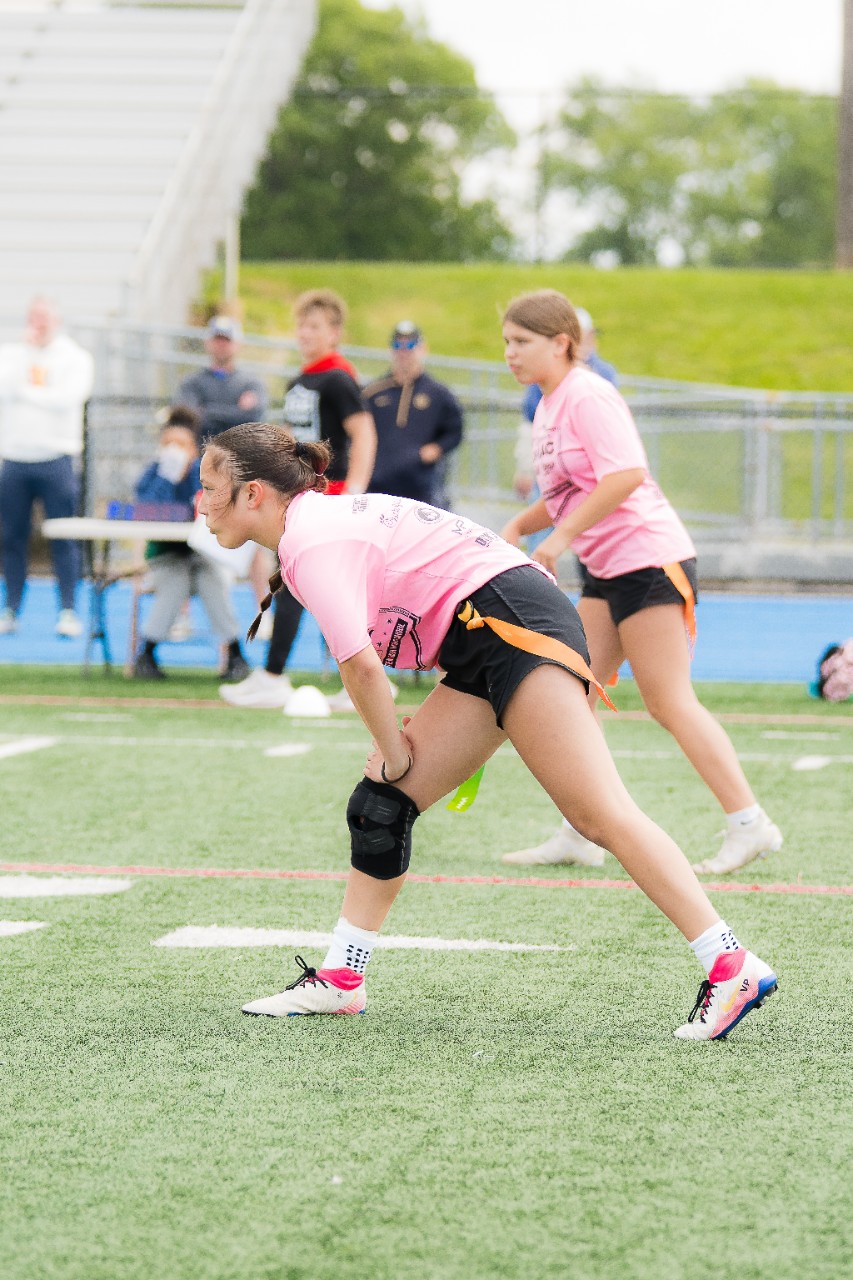 Female athletes playing flag football at NFL Jahan Dotson's camp.