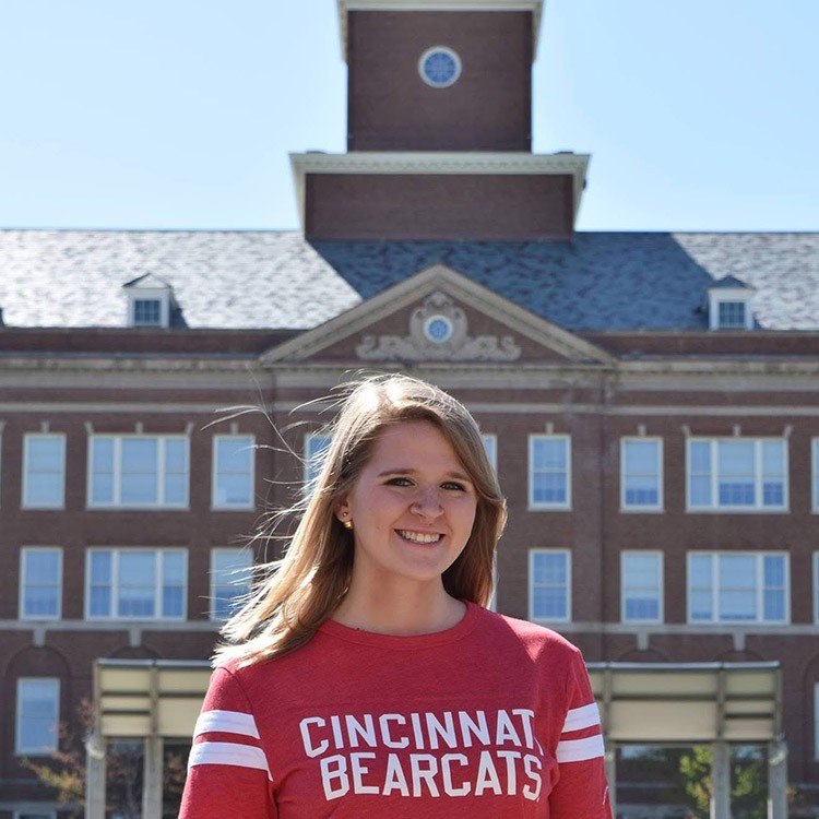 Abby Revetta poses in front of Arts and Sciences Hall on the campus of University of Cincinnati